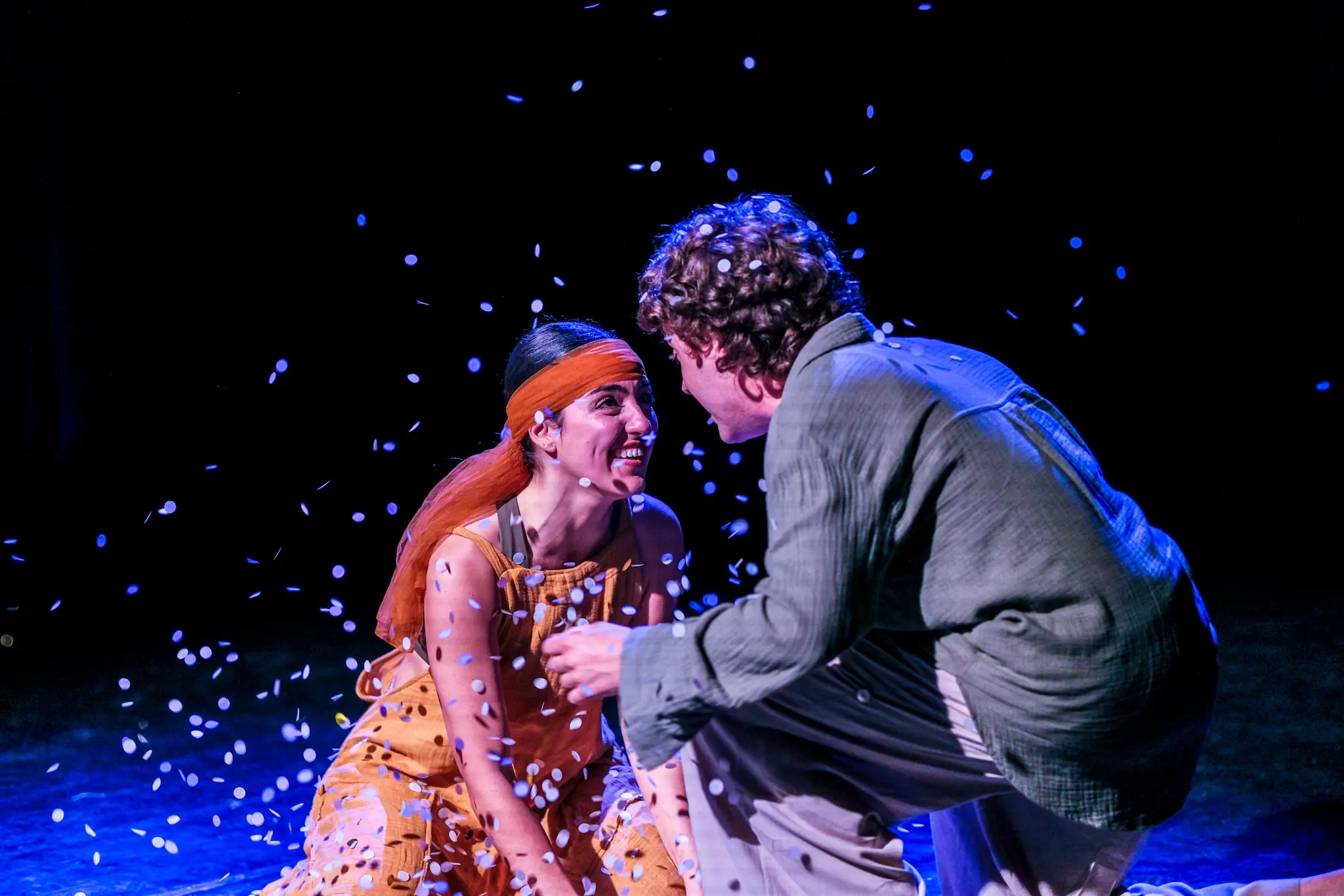 Shakespeare's A Midsummer Night's dream played on the main stage with two actors embracing one another.