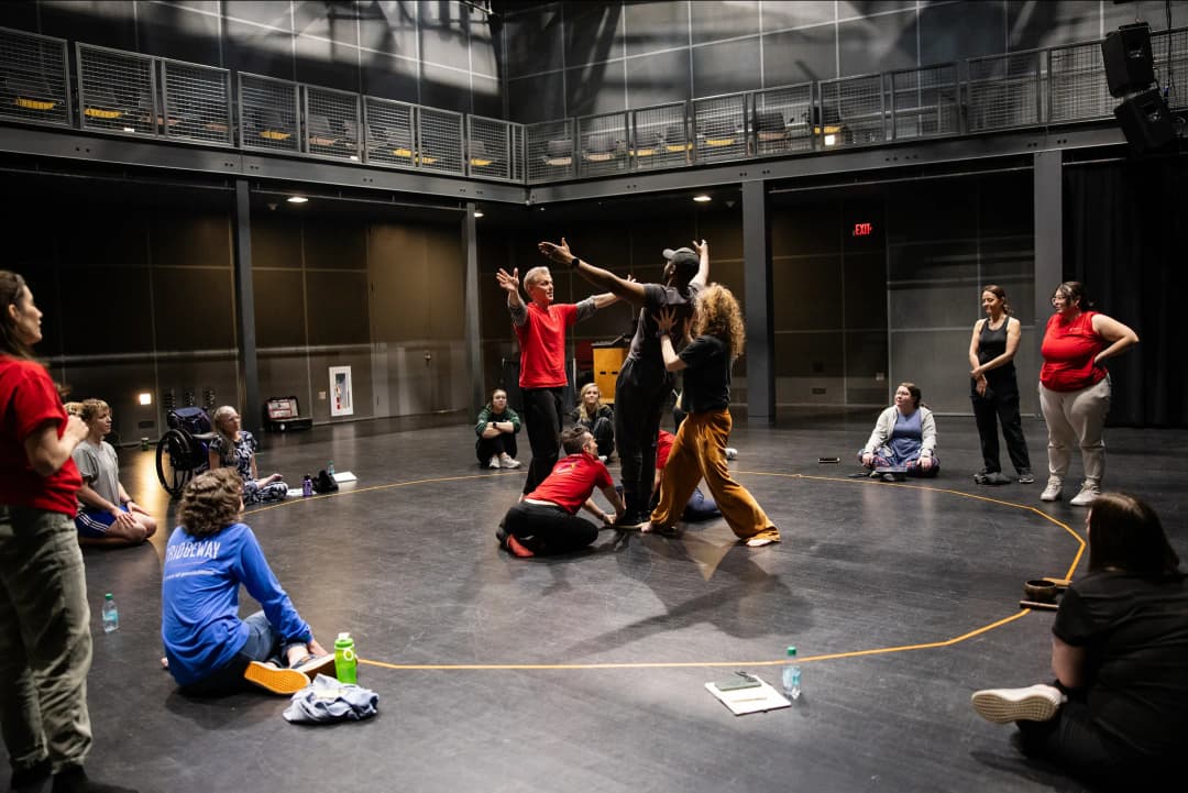 Flute Theatre actors and participants at OSU Wexner Center in Ohio creating a powerful ensemble moment during the Shakespeare and Autism program 2025, fostering inclusive sensory-friendly theatre for neurodiverse audiences.